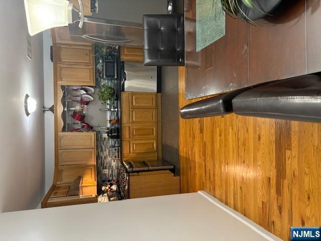 847 Bond Street, Unit 1 Elizabeth, NJ 07201 - Photo 8 of 10 a kitchen with stainless steel appliances granite countertop a sink and a stove