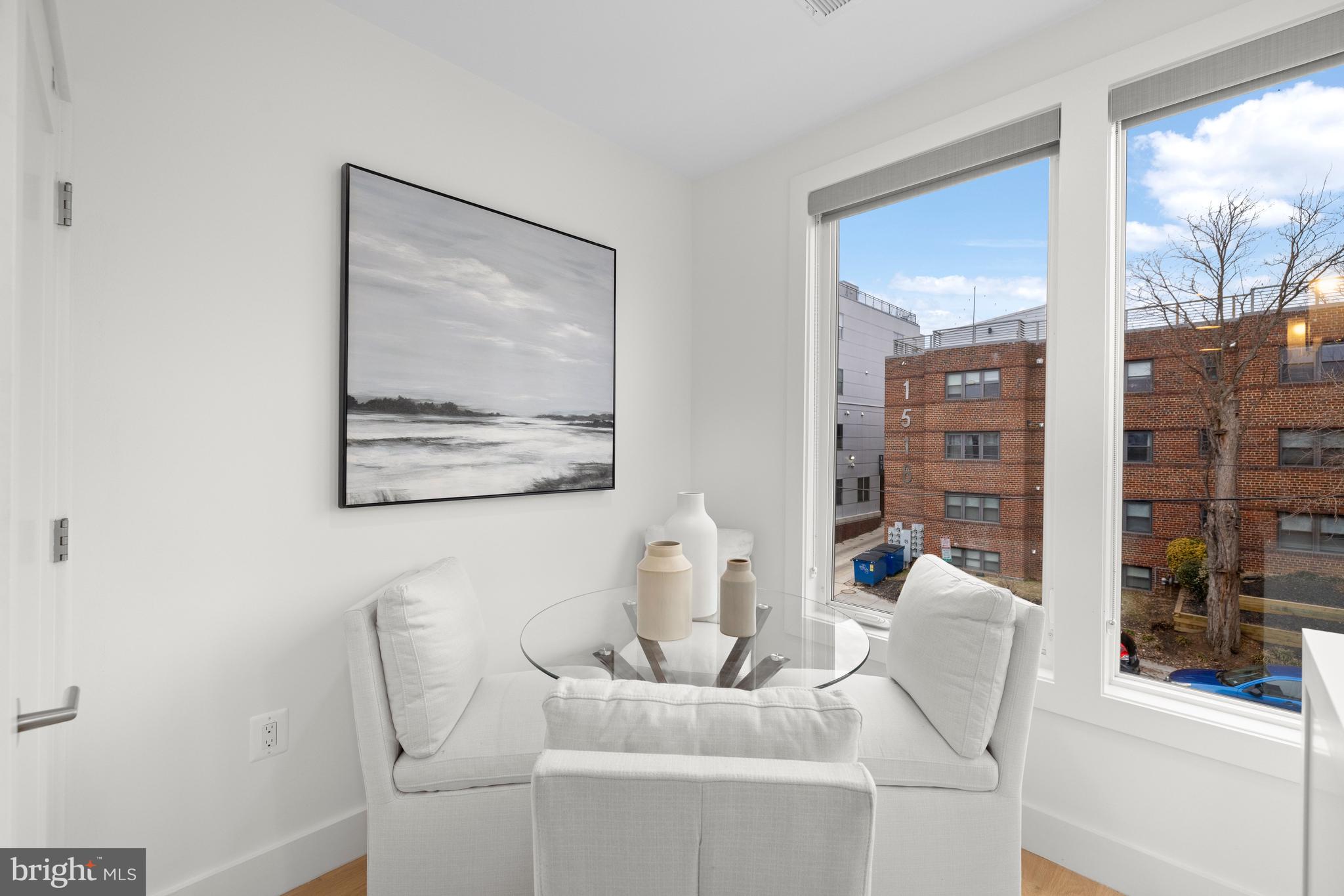 1515 K Street Southeast, Unit 3 Washington, DC 20003 - Photo 4 of 22 a living room with furniture a lamp and large window