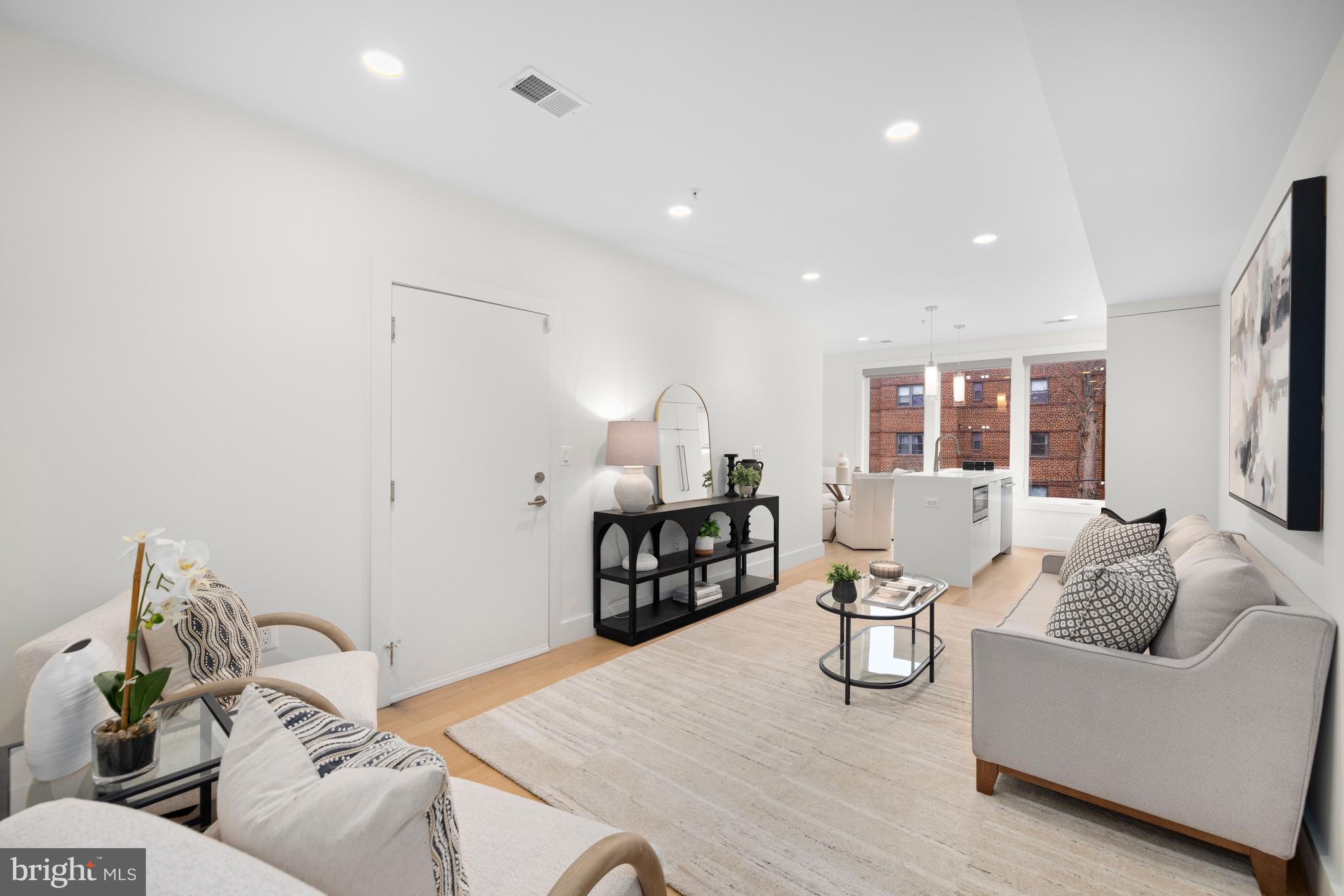 1515 K Street Southeast, Unit 3 Washington, DC 20003 - Photo 6 of 22 a living room with furniture and a table