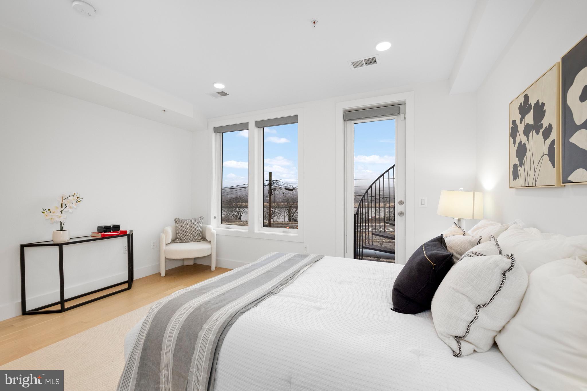 1515 K Street Southeast, Unit 3 Washington, DC 20003 - Photo 9 of 22 a bedroom with a bed and a large window