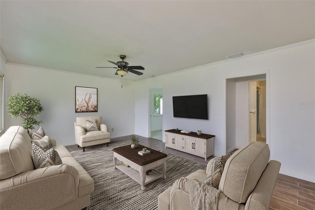 106 West North Branch Road Ruskin, FL 33570 - Photo 10 of 29 a living room with furniture and a flat screen tv