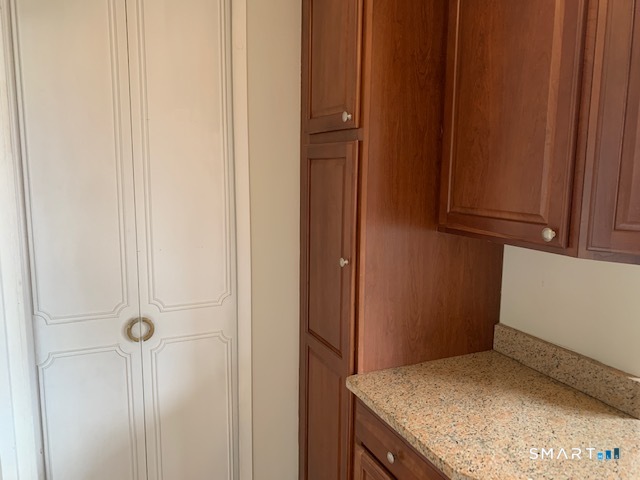 50 Glenbrook Road, Unit 5G Stamford, CT 06902 - Photo 21 of 40 a bathroom with a granite countertop sink and vanity