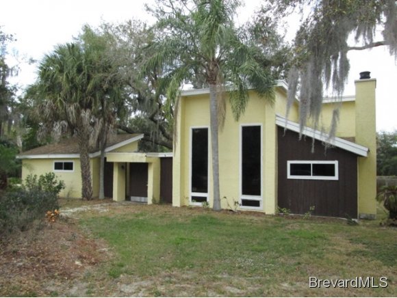 4304 Crooked Mile Road Merritt Island, FL 32952 - Photo 1 of 16 front view of a house with a yard
