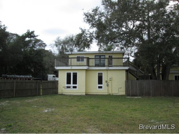 4304 Crooked Mile Road Merritt Island, FL 32952 - Photo 12 of 16 front view of a house with a yard