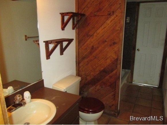 4304 Crooked Mile Road Merritt Island, FL 32952 - Photo 6 of 16 a bathroom with a toilet and a sink