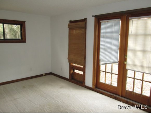4304 Crooked Mile Road Merritt Island, FL 32952 - Photo 7 of 16 an empty room with a window
