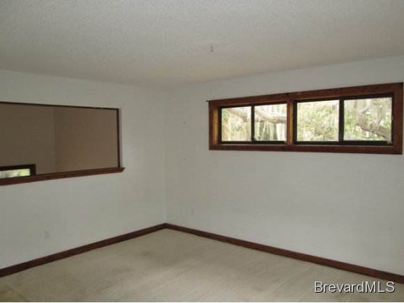 4304 Crooked Mile Road Merritt Island, FL 32952 - Photo 8 of 16 an empty room with a window