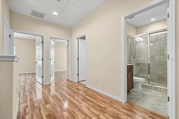 a bathroom with a shower and a sink