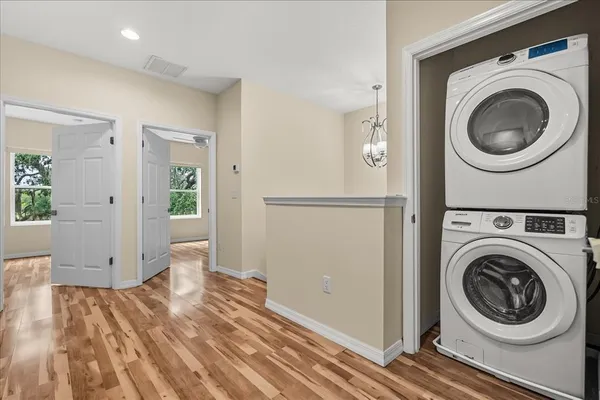 a view of a hallway with washer and dryer