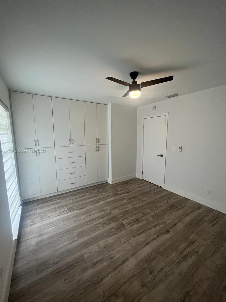 Heathgate Street Tamarac, FL 33321 - Photo 15 of 23 a view of empty room with wooden floor