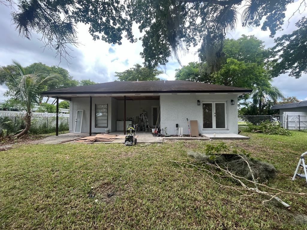 Heathgate Street Tamarac, FL 33321 - Photo 19 of 23 a front view of house with yard and outdoor seating