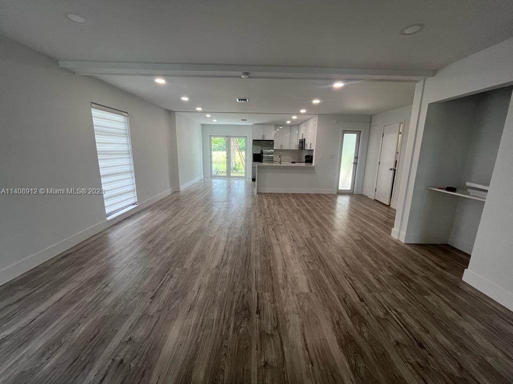 Heathgate Street Tamarac, FL 33321 - Photo 2 of 23 a view of kitchen with cabinets appliances and wooden floor