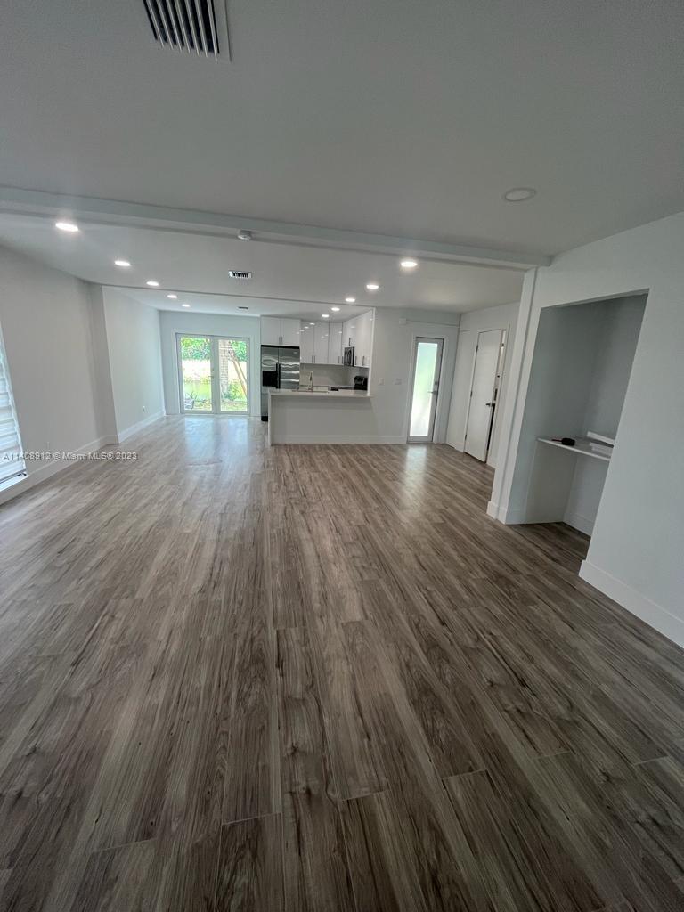 Heathgate Street Tamarac, FL 33321 - Photo 6 of 23 a view of an empty room and wooden floor