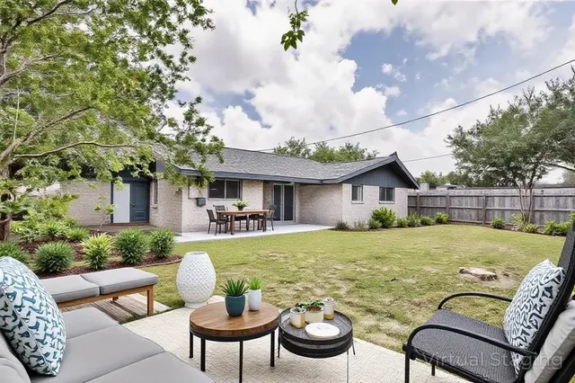 a view of a house with swimming pool and porch with furniture