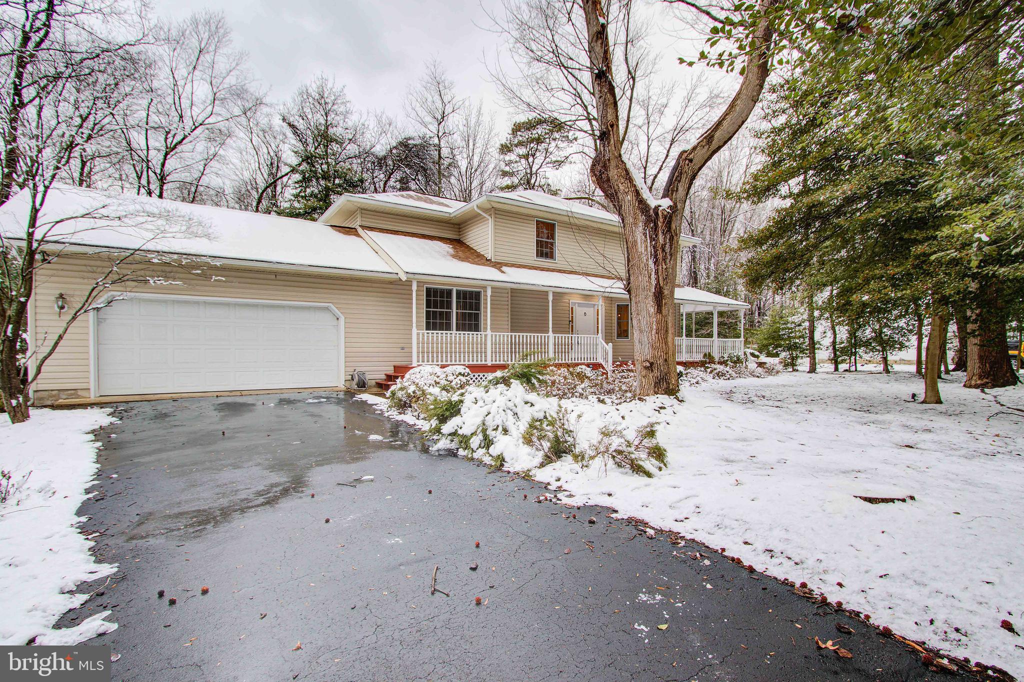 Long driveway and expansive garage