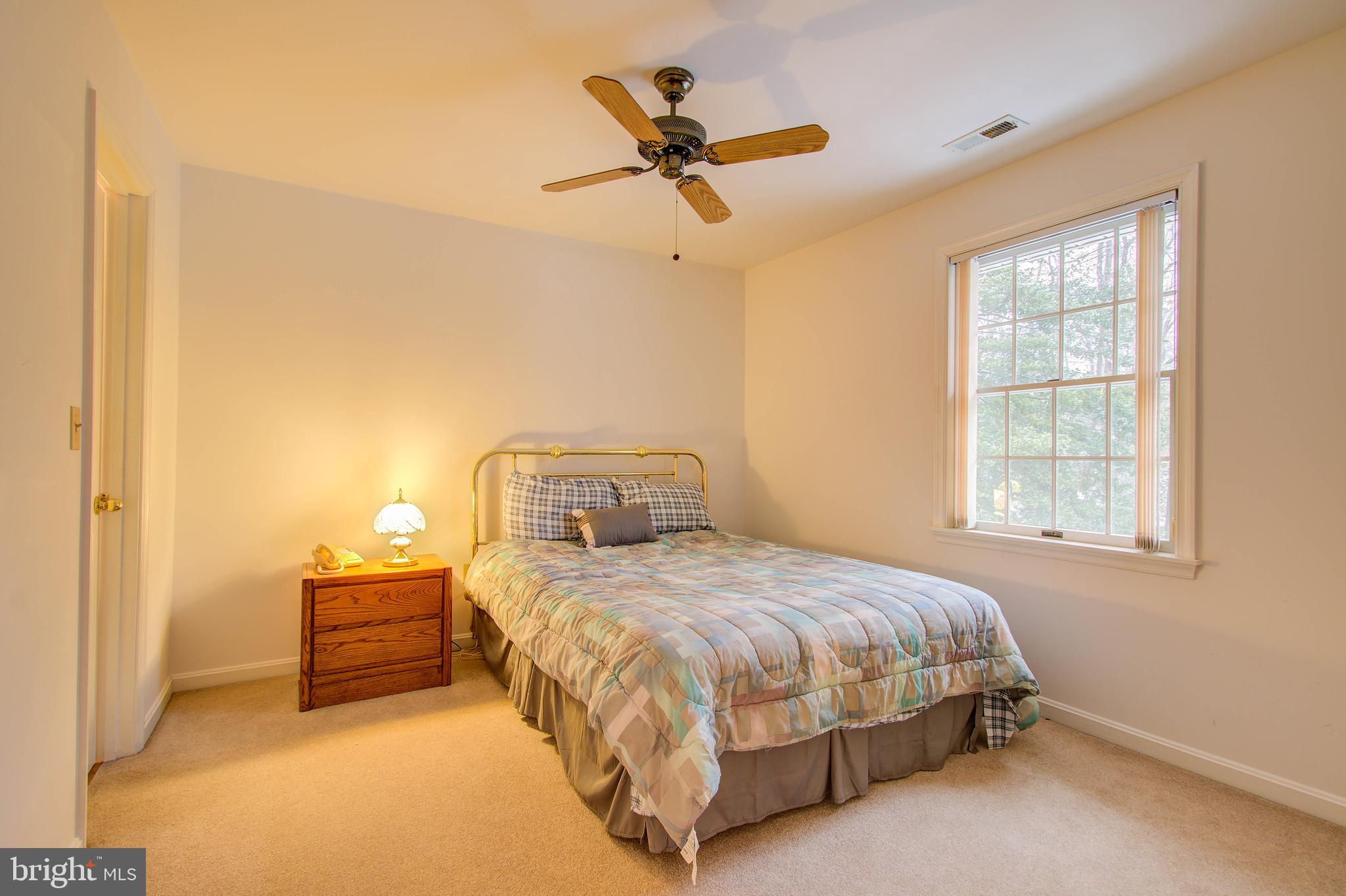 8308 Patapsco Road Pasadena, MD 21122 - Photo 17 of 25 One of two additional upper level bedrooms