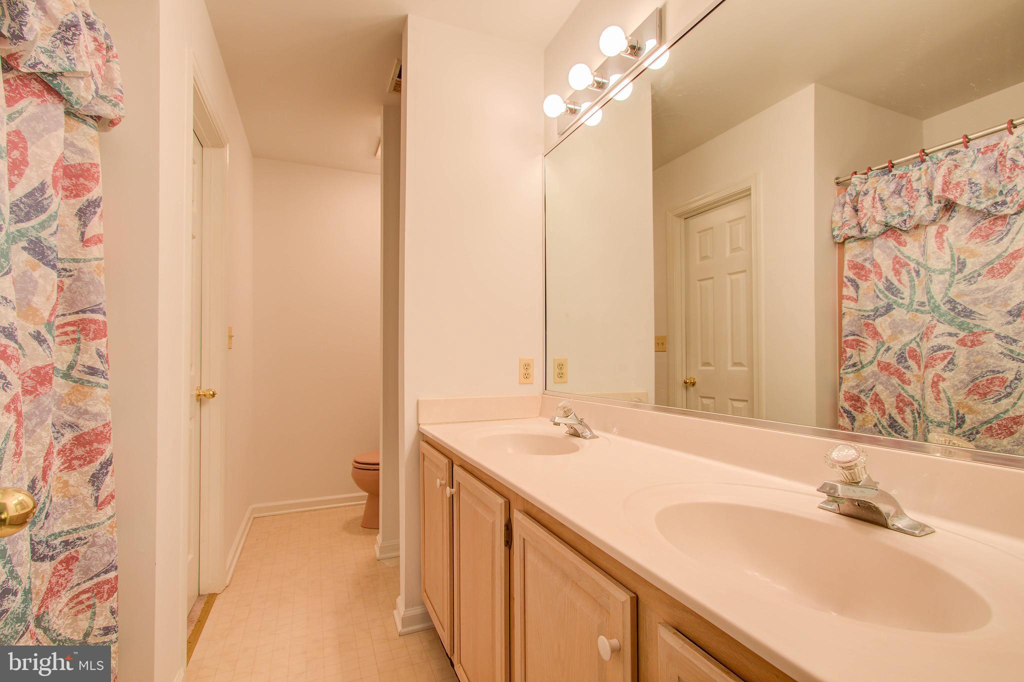 8308 Patapsco Road Pasadena, MD 21122 - Photo 19 of 25 Jack and Jill bathroom