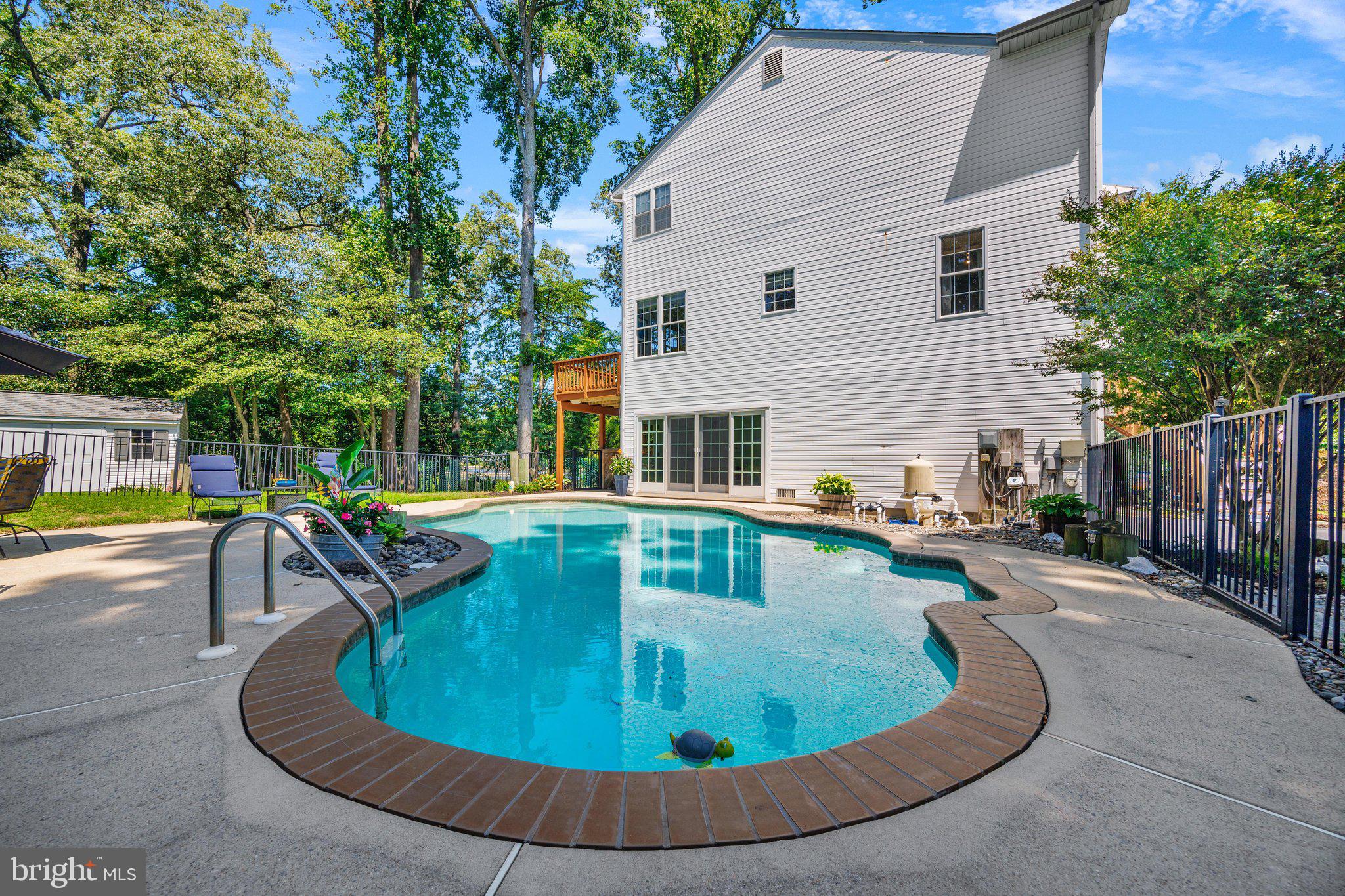 233 Circle Road Pasadena, MD 21122 - Photo 42 of 59 Pool has built in seating in deep end.