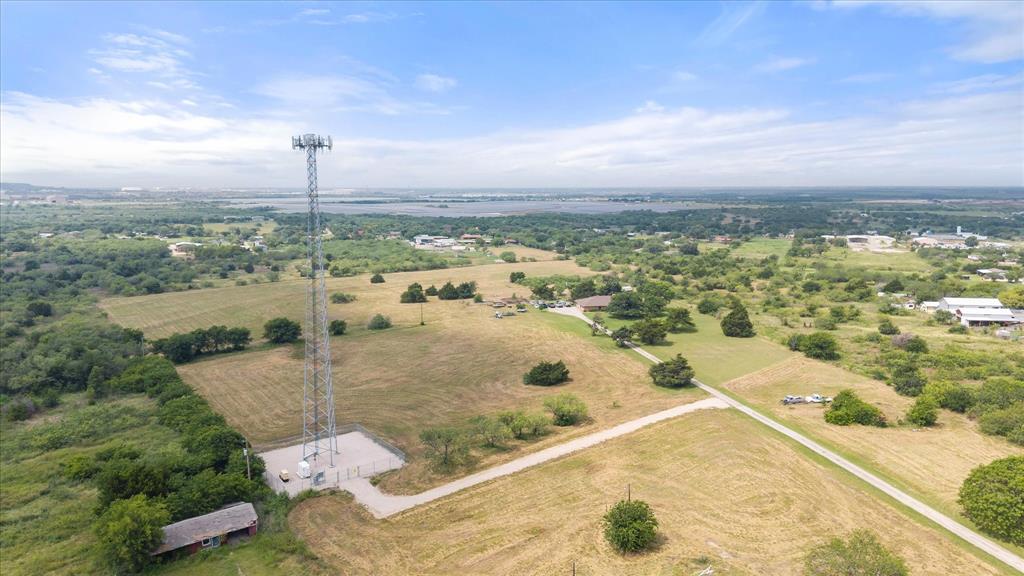 3748 Old Fort Worth Road Midlothian, TX 76065 - Photo 13 of 40 Cell phone tower is under a 40 year lease which began in 2024. The lease is for 75' x75' with an easement to it. The current easment driveway doesn't match the survey exactly, as it was rerouted (it can be moved) to go around the well.
