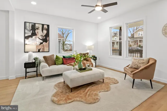 a kitchen with stainless steel appliances granite countertop a table chairs sink and cabinets