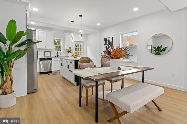a living room with furniture and a mirror