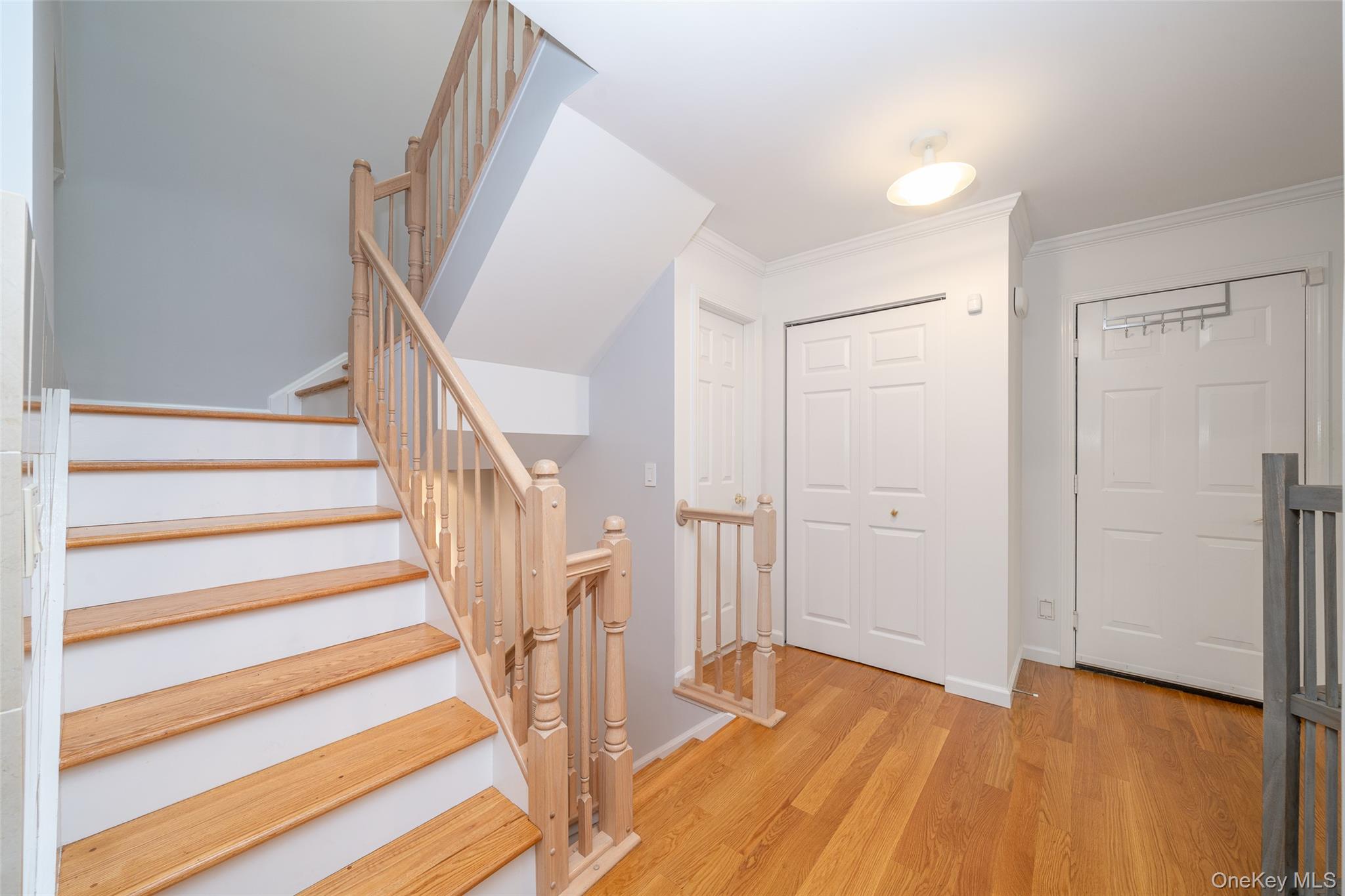 9 High Ridge Road Ossining, NY 10562 - Photo 17 of 50 a view of entryway with wooden floor and stairs
