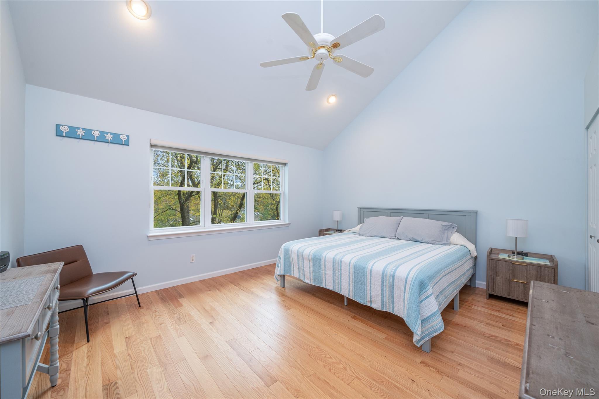 9 High Ridge Road Ossining, NY 10562 - Photo 18 of 50 a bedroom with a large bed chandelier and a window
