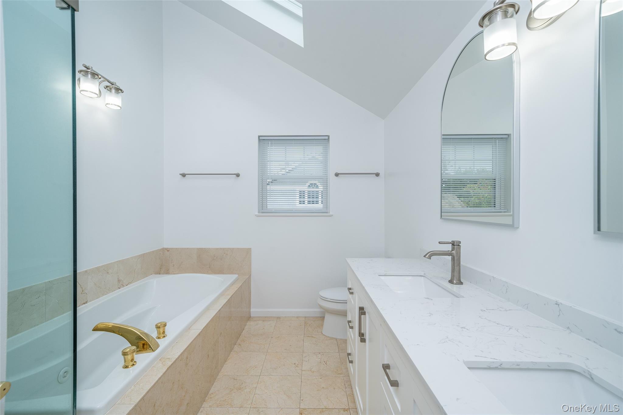 9 High Ridge Road Ossining, NY 10562 - Photo 20 of 50 a bathroom with a tub sink and mirror