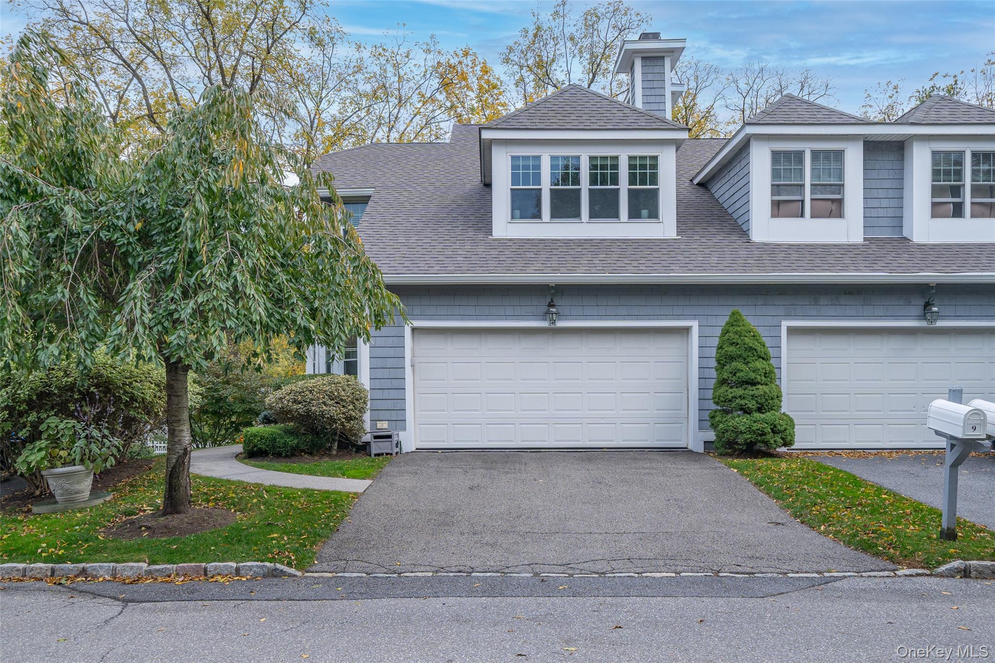9 High Ridge Road Ossining, NY 10562 - Photo 2 of 50 a front view of a house with a yard and garage
