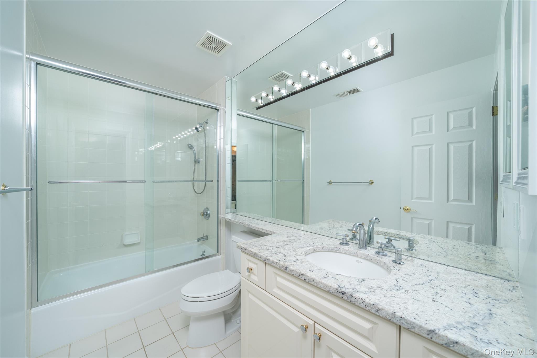 9 High Ridge Road Ossining, NY 10562 - Photo 22 of 50 a bathroom with a granite countertop sink toilet and shower