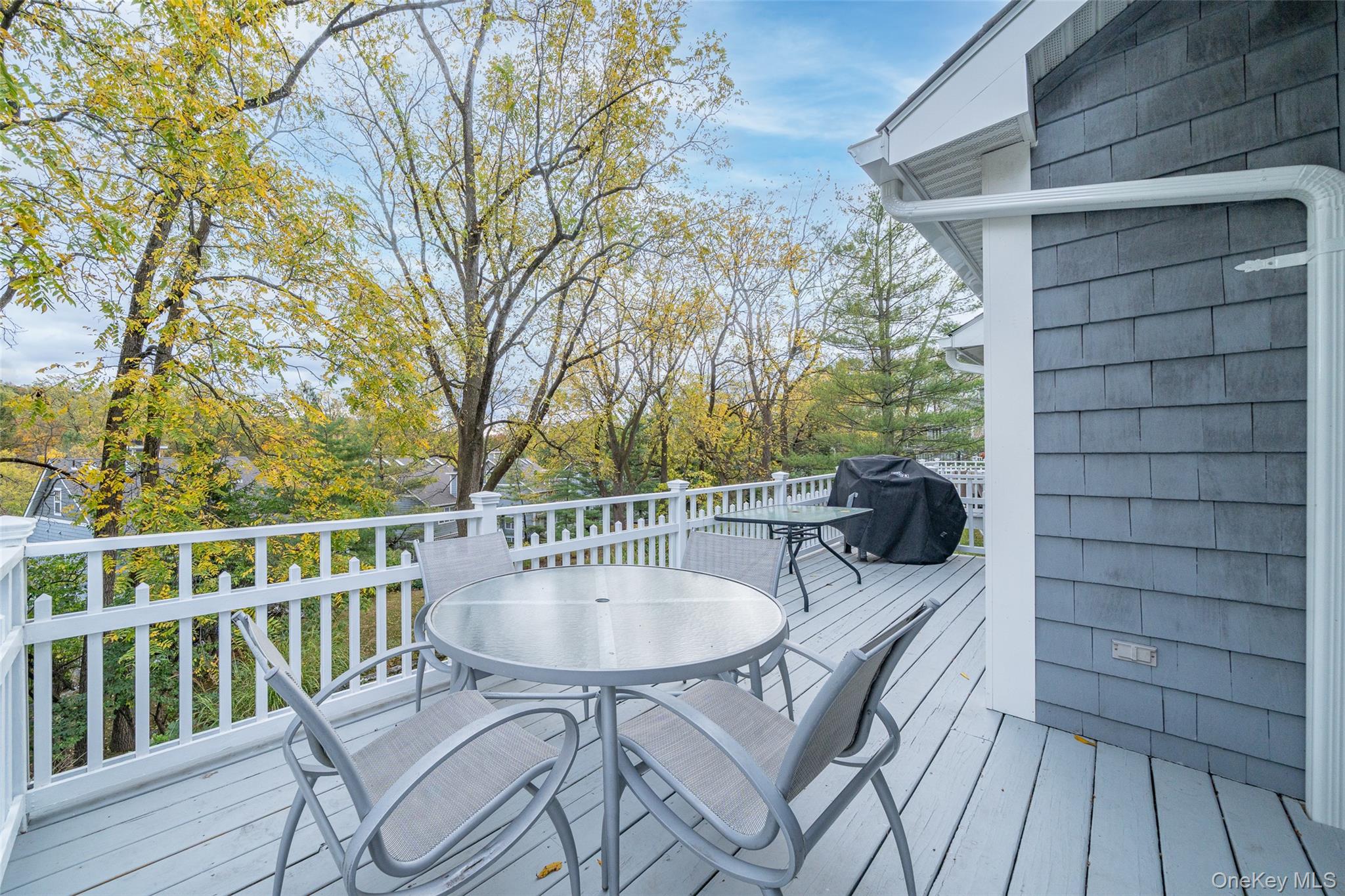 9 High Ridge Road Ossining, NY 10562 - Photo 3 of 50 a view of a chairs and table on the deck