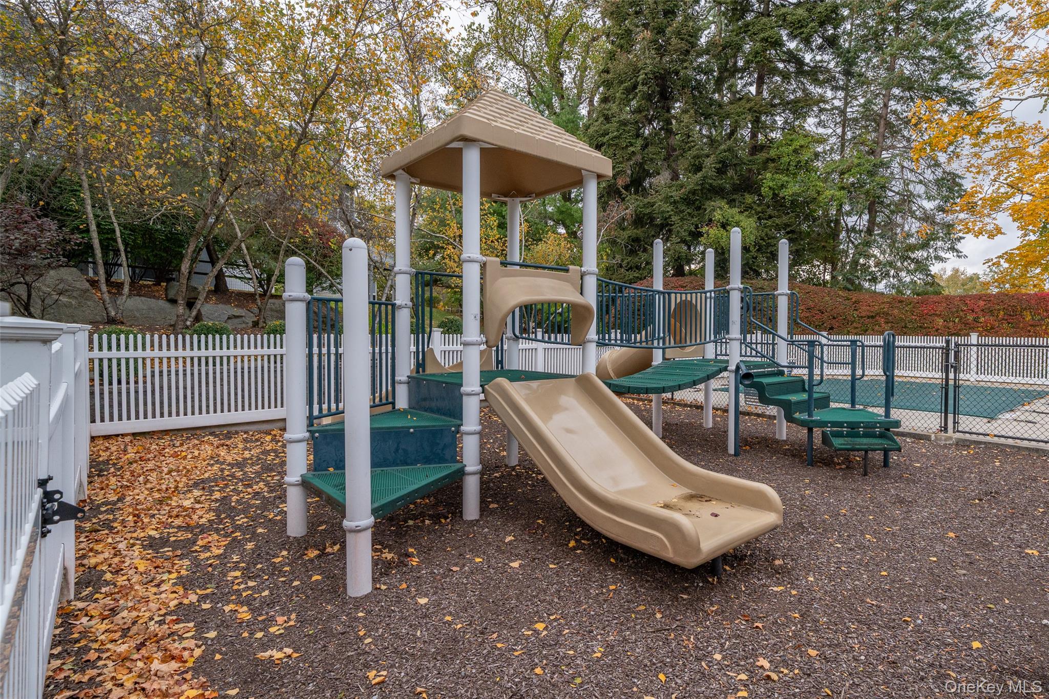 9 High Ridge Road Ossining, NY 10562 - Photo 44 of 50 a view of a patio with a table chairs and a small yard