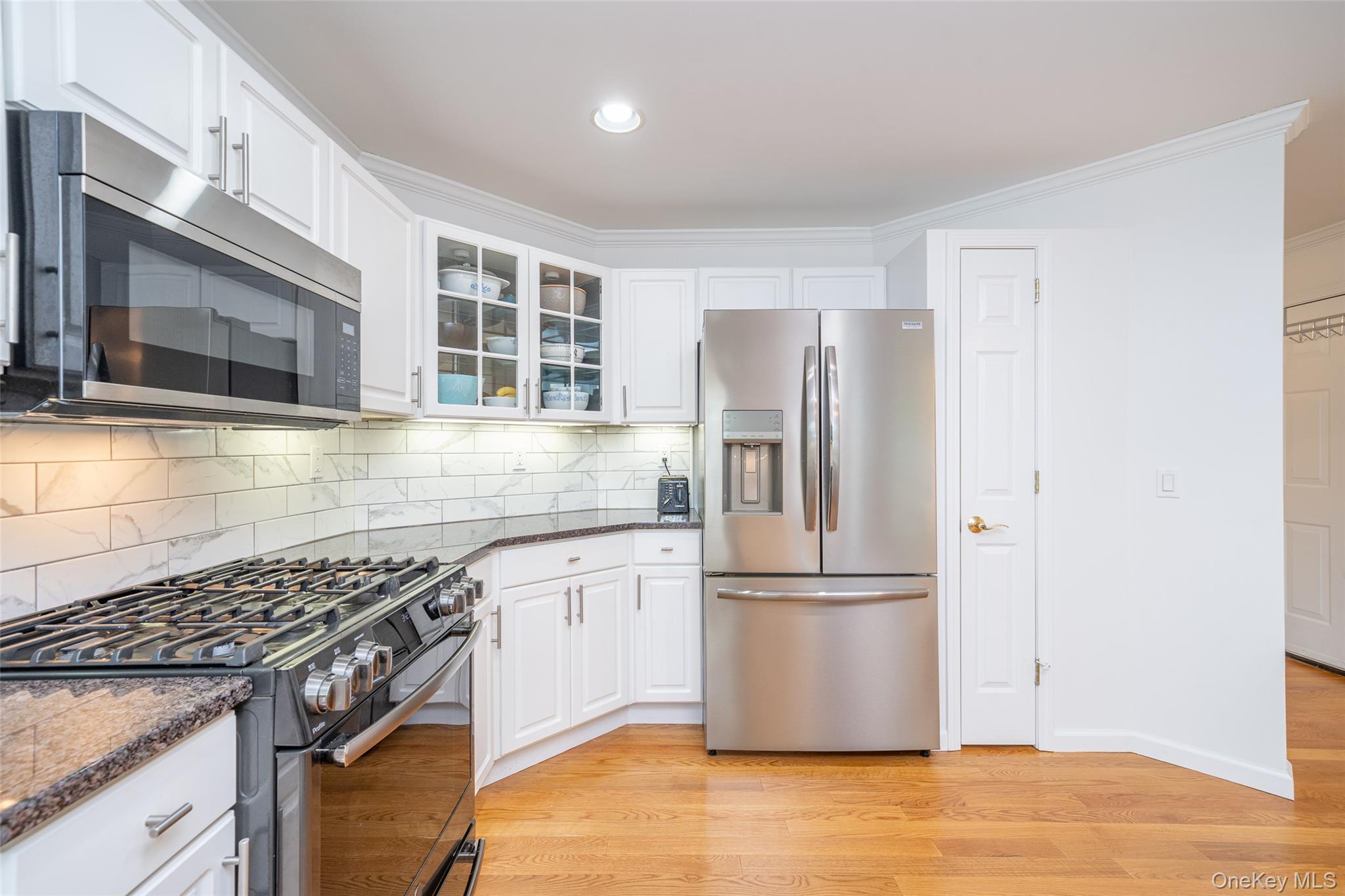 9 High Ridge Road Ossining, NY 10562 - Photo 9 of 50 a kitchen with granite countertop a refrigerator and a stove top oven