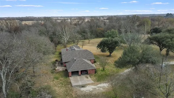 a aerial view of a house with mountain view