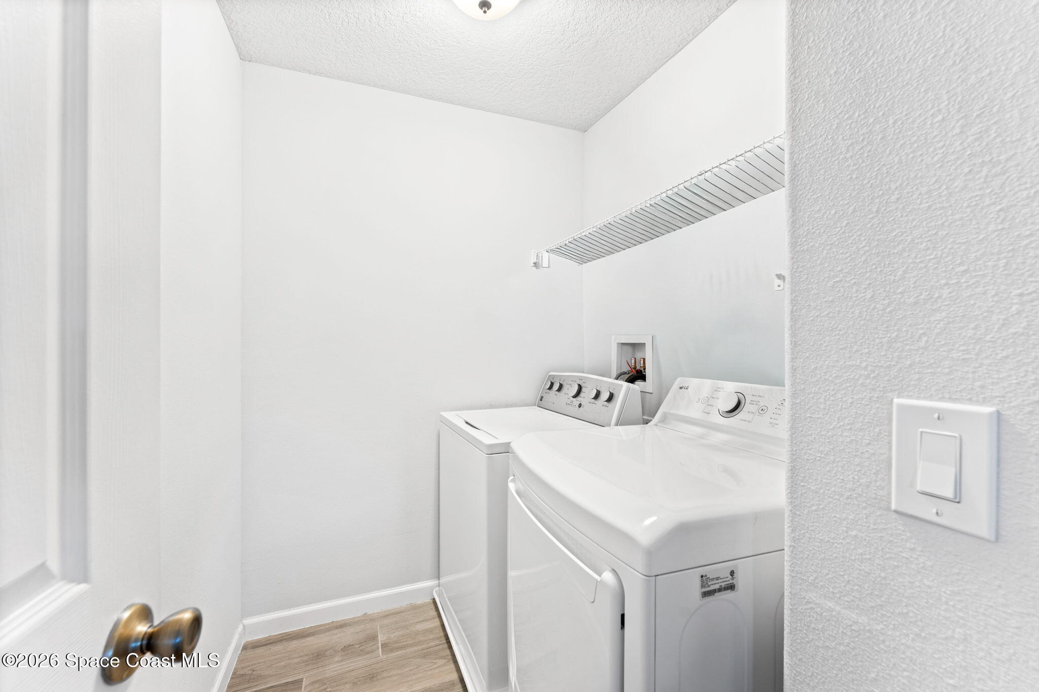 1415 Lara Circle, Unit 106 Rockledge, FL 32955 - Photo 30 of 42 a utility room with dryer and washer
