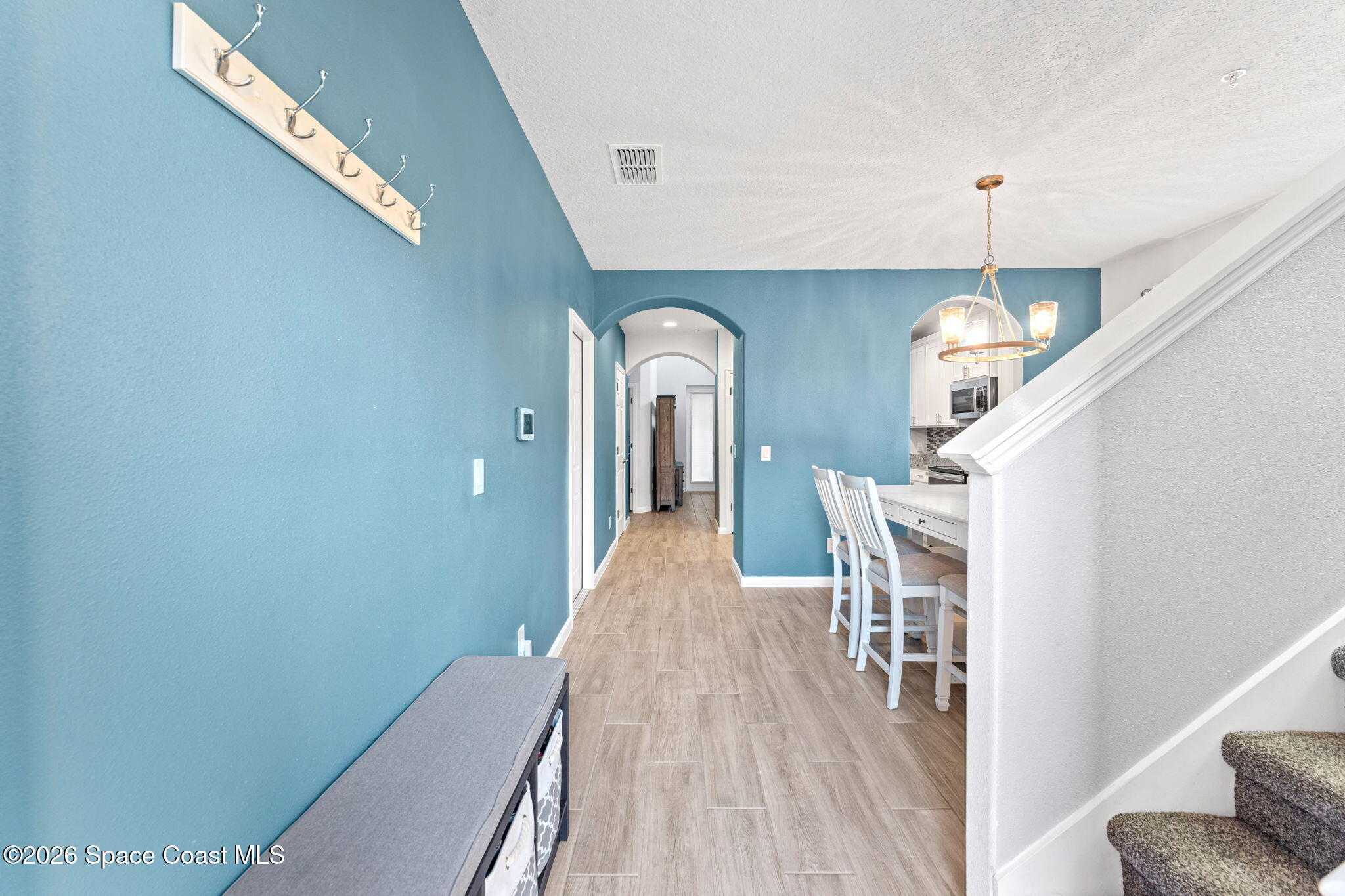 1415 Lara Circle, Unit 106 Rockledge, FL 32955 - Photo 5 of 42 a view of a hallway with furniture
