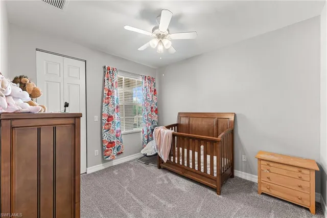 a bed room with a bed and a window