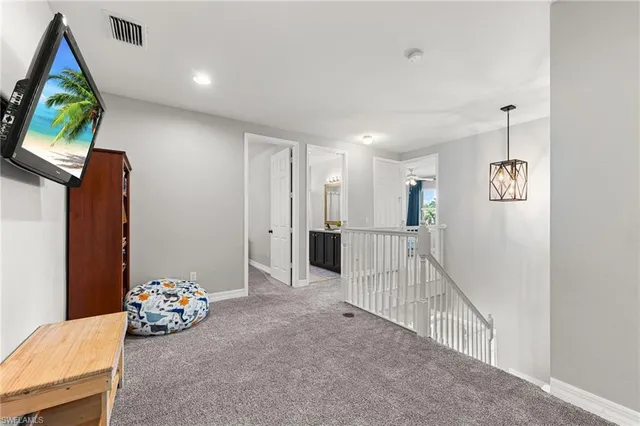 a view of a livingroom with furniture and toys