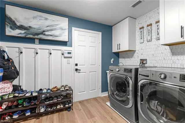 a view of a utility room with washer and dryer