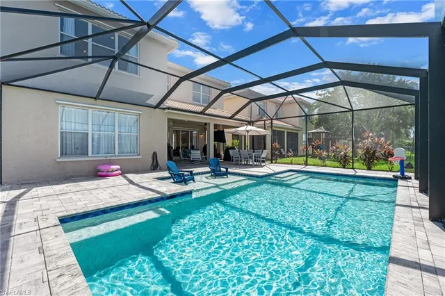 a view of swimming pool with a patio