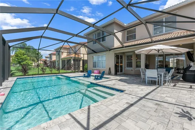 a view of a chairs and table in patio