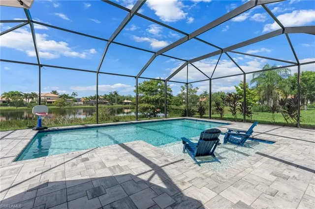 a view of a chair and table in the patio