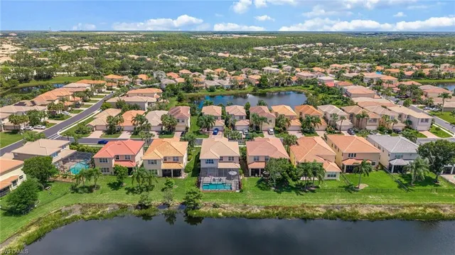 an aerial view of residential building with outdoor space and swimming pool