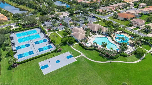a view of a play ground with a building in the background