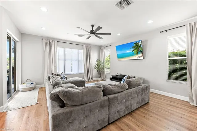 a living room with furniture and windows