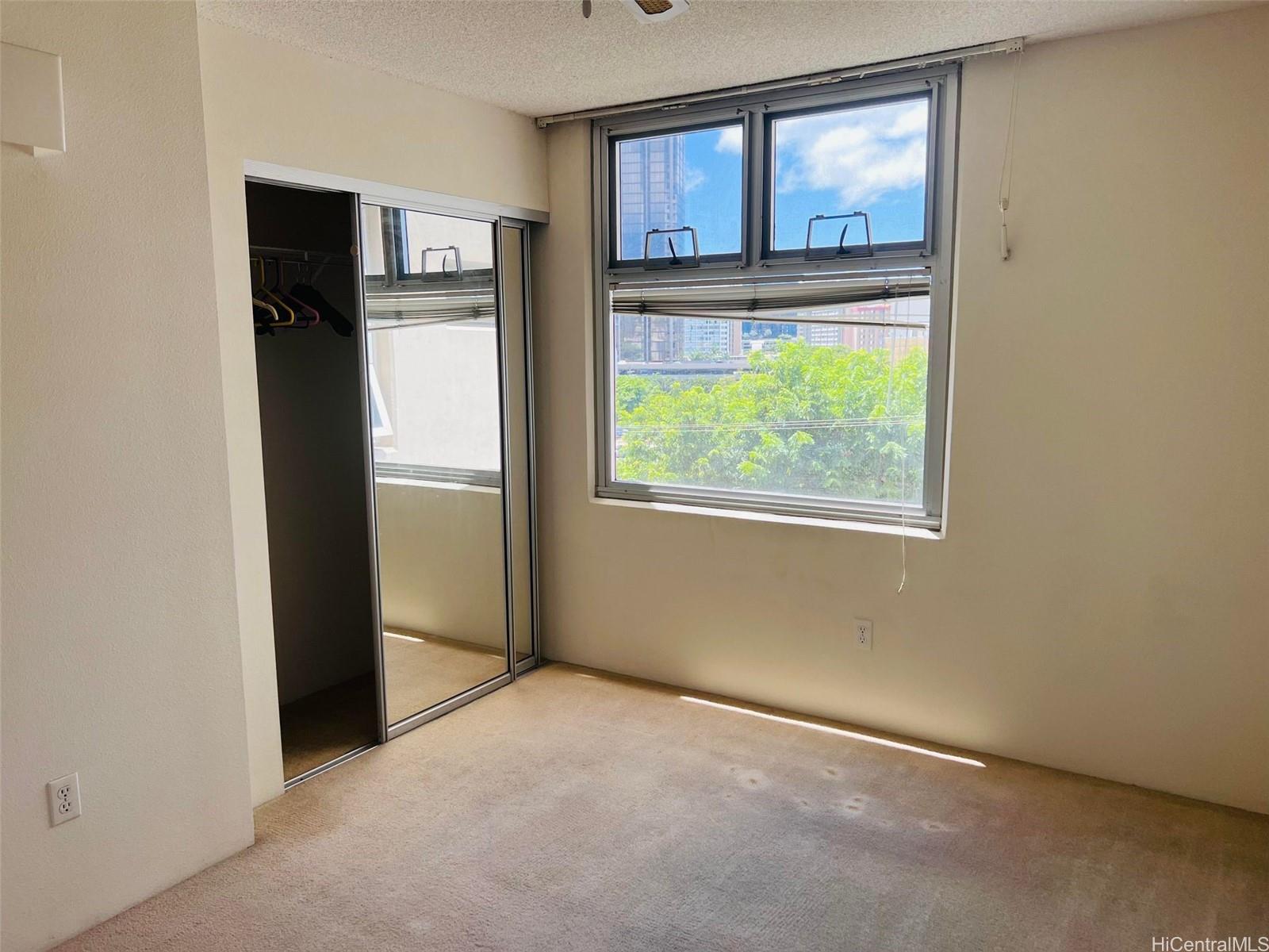 1448 Young Street, Unit 501 Honolulu, HI 96814 - Photo 12 of 17 an empty room with window