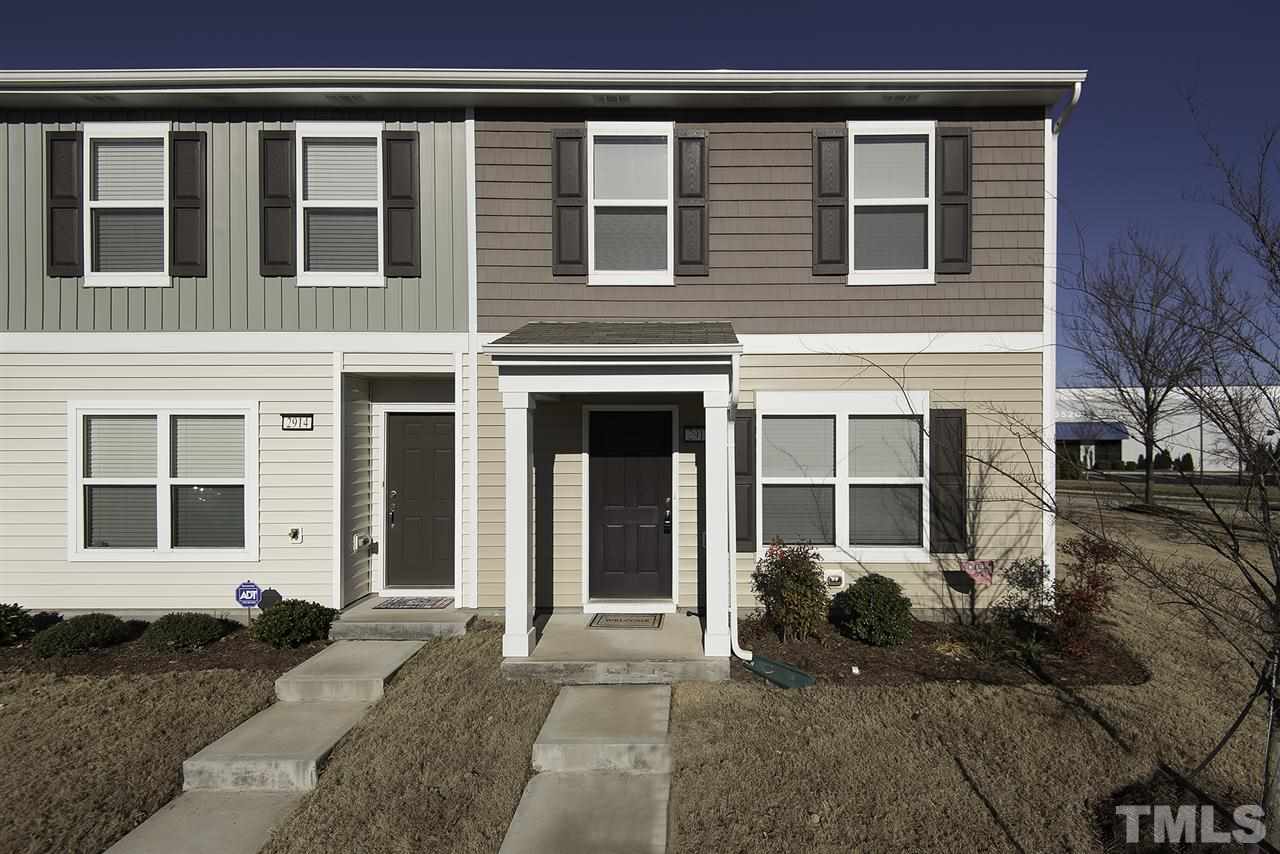2912 Berkeley Springs Place Raleigh, NC 27616 - Photo 1 of 19 a front view of a house with a yard