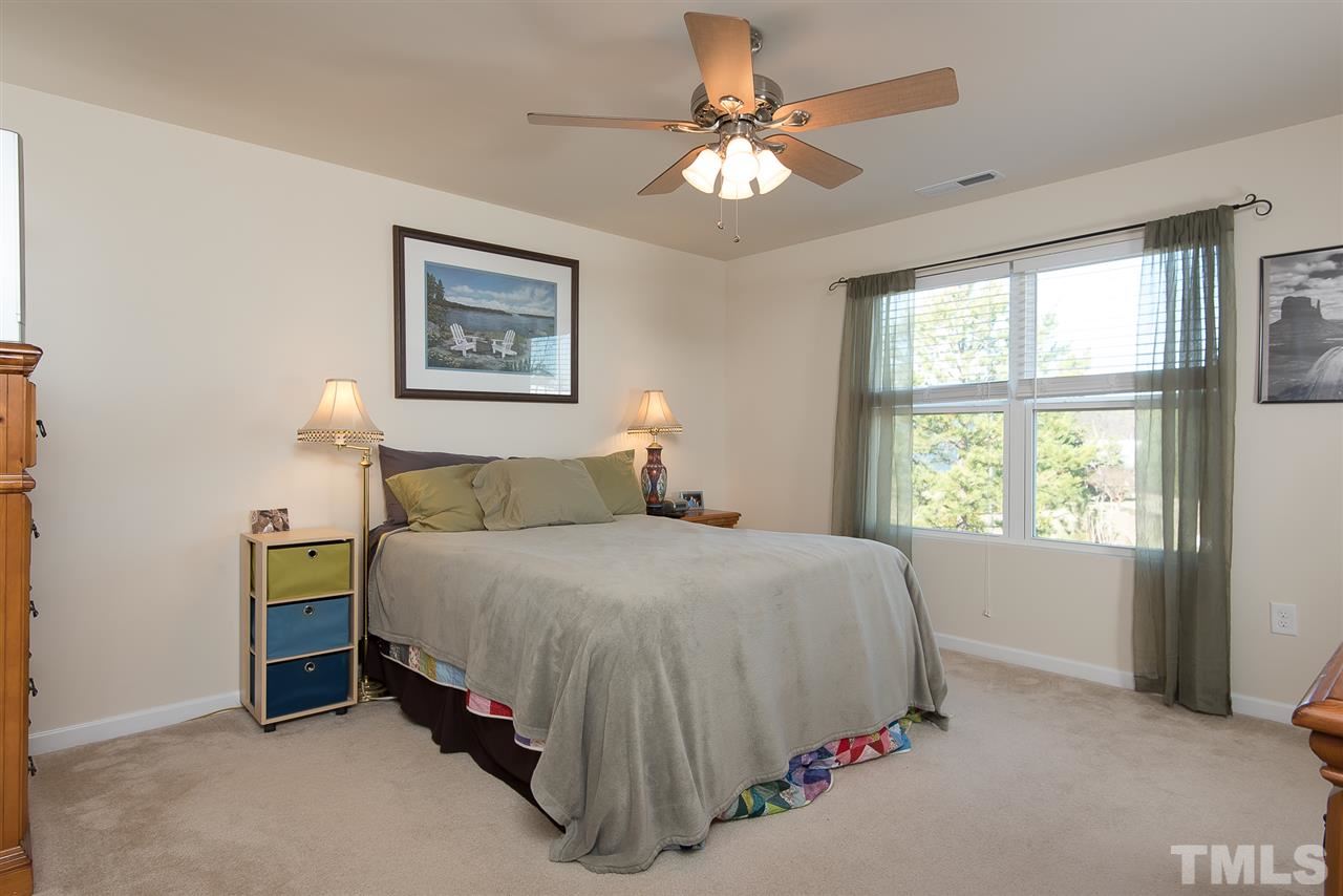 2912 Berkeley Springs Place Raleigh, NC 27616 - Photo 11 of 19 a spacious bedroom with a bed and a window