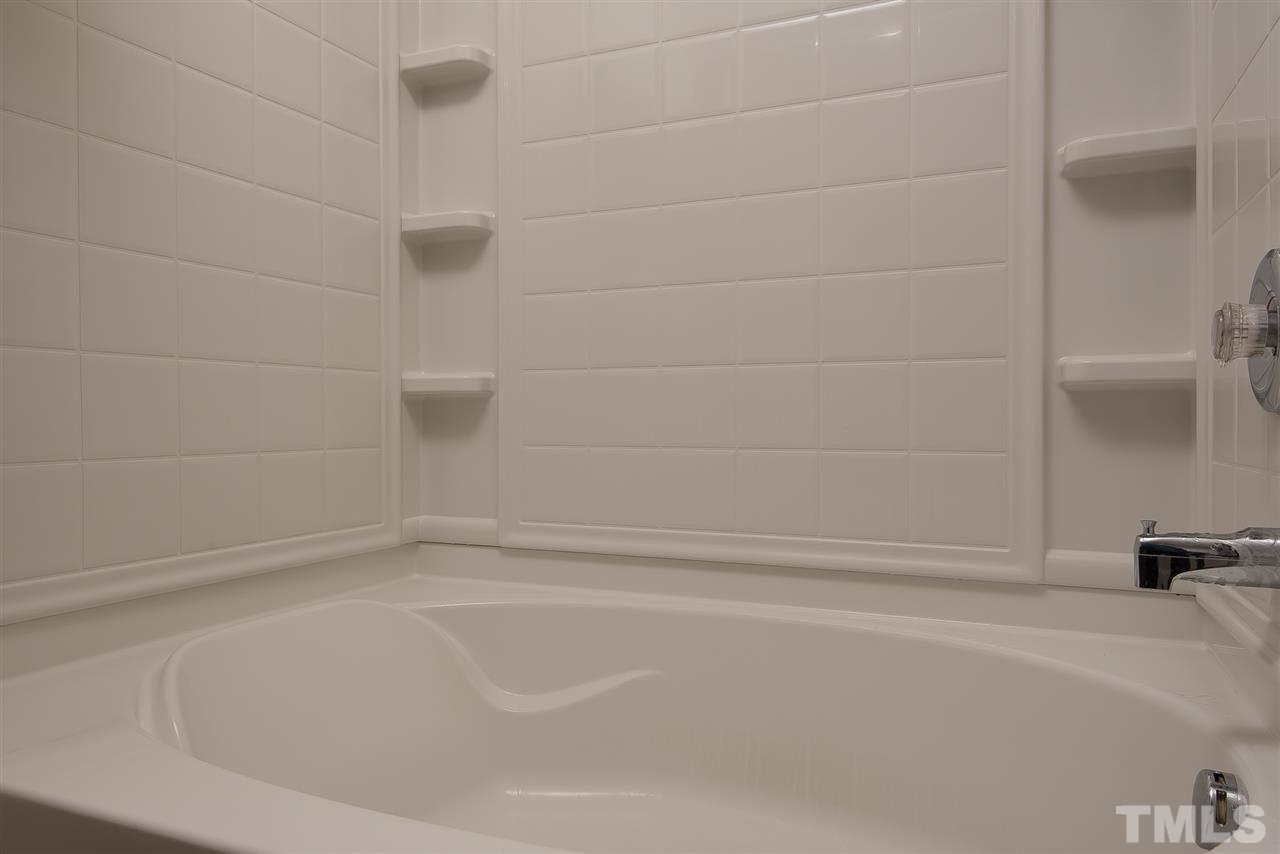 2912 Berkeley Springs Place Raleigh, NC 27616 - Photo 13 of 19 a close up of a bathtub