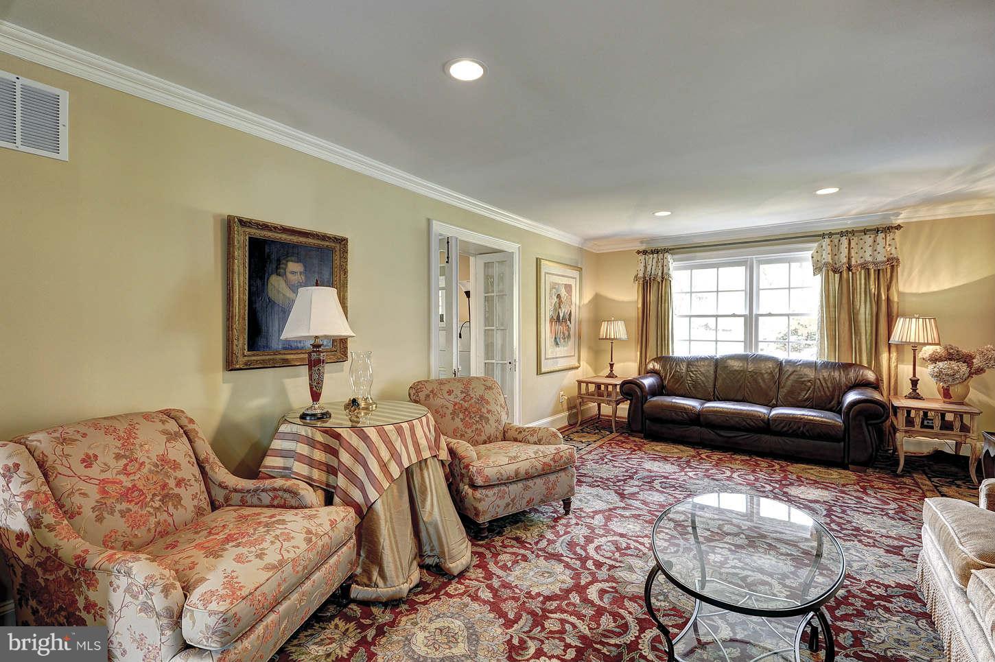 10017 Chapel Road Potomac, MD 20854 - Photo 4 of 26 a living room with furniture and a window
